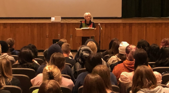 A Holocaust survivor speaks to students at an assembly, made possible by funding from an MSHEF educational grant.